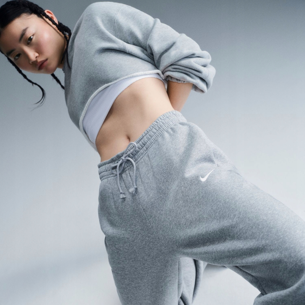 Женские теннисные брюки Nike Sportswear Phoenix Fleece - dark grey heather/sail