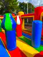 Коммерческий надувной батут «Драконы в тропиках» с механизированной головой, 14*7*7,3 м