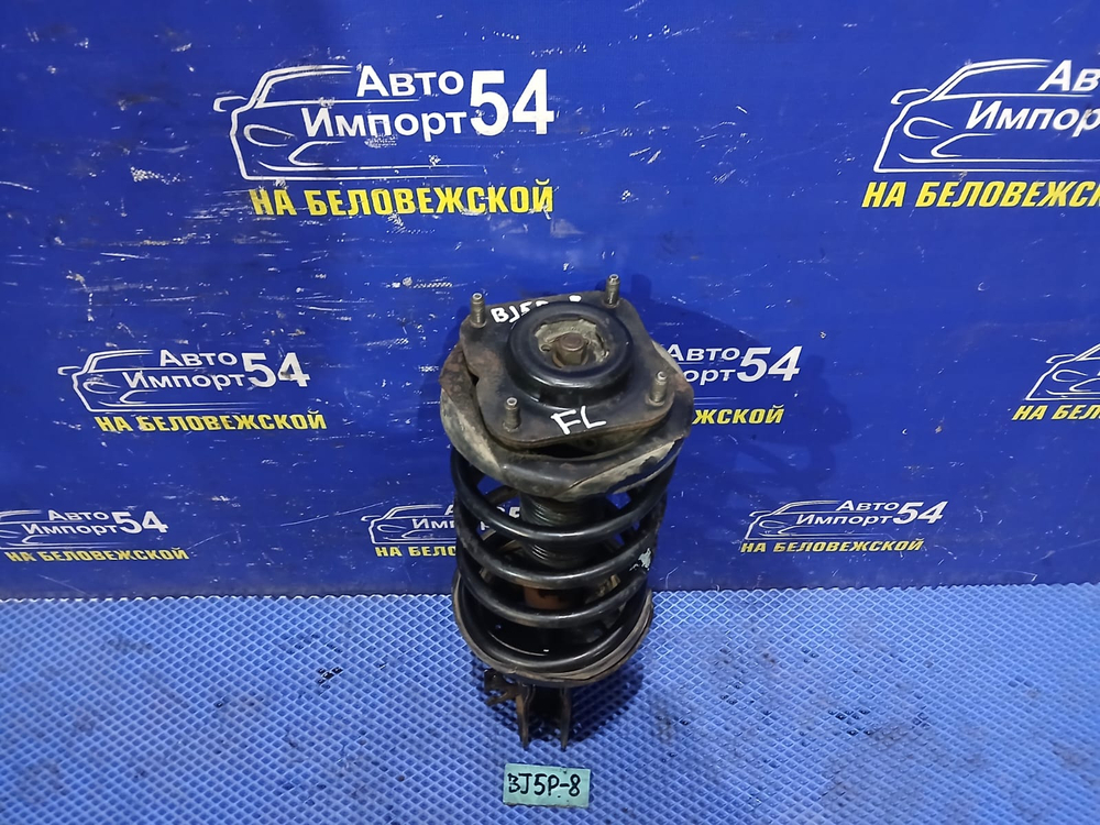 Стойка передняя левая MAZDA FAMILIA 2003