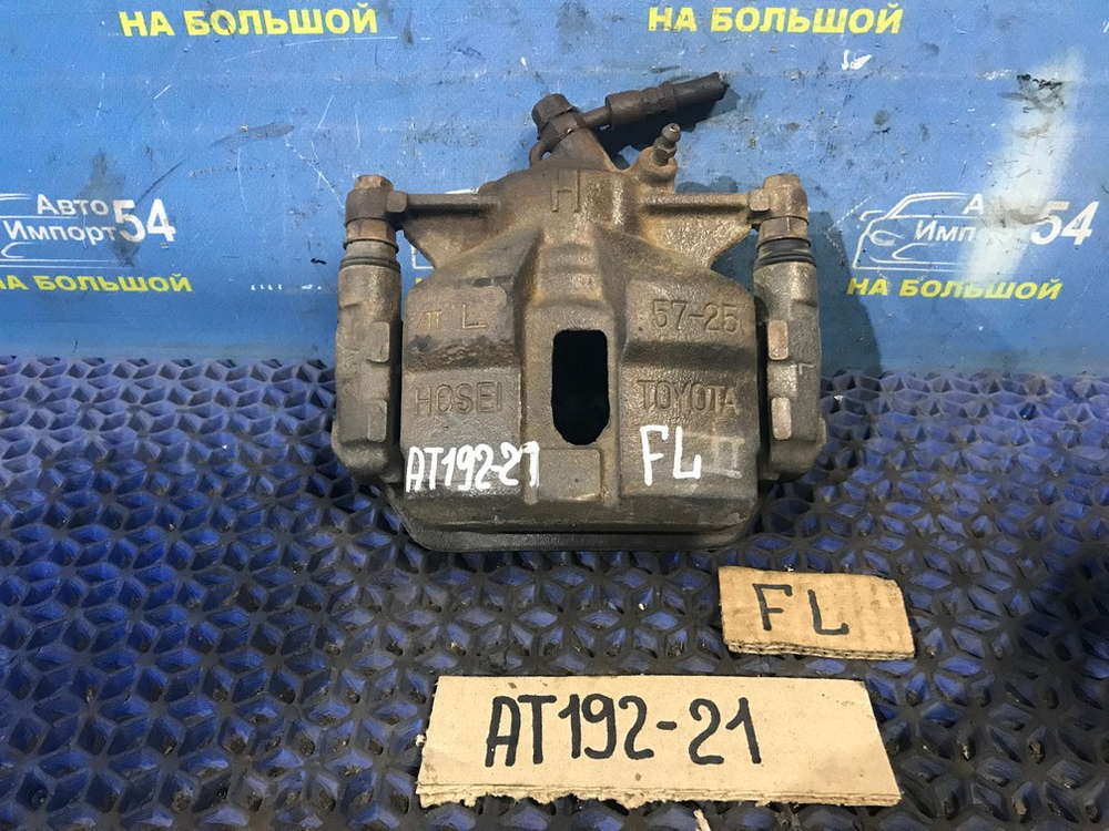 Суппорт тормозной передний левый TOYOTA CARINA 1994