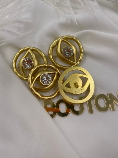 Пуговицы Скиапар. матовое светлое золото "Глаз" со стразом