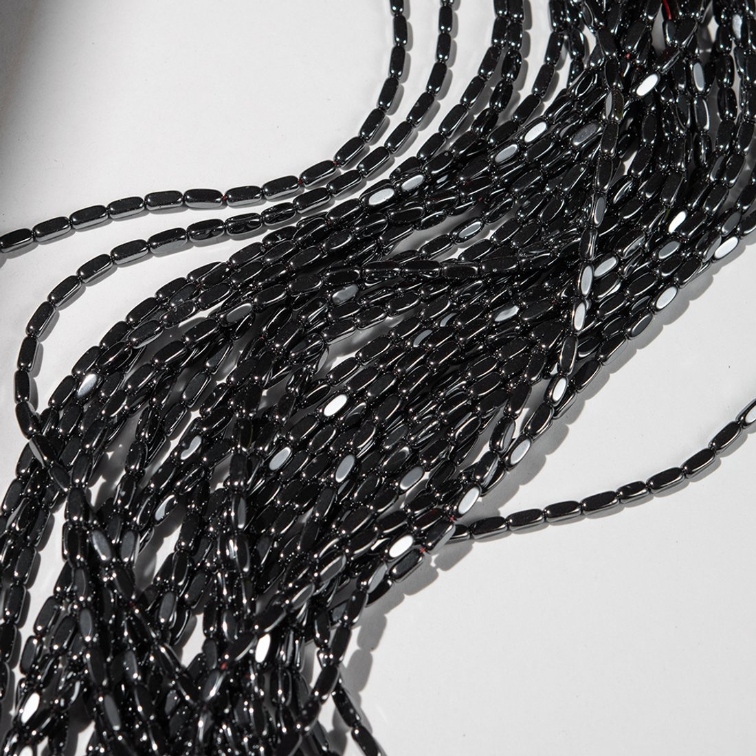 Гематин (гематит), оттенок "Gun Metal", рис с гранями, 3*7мм