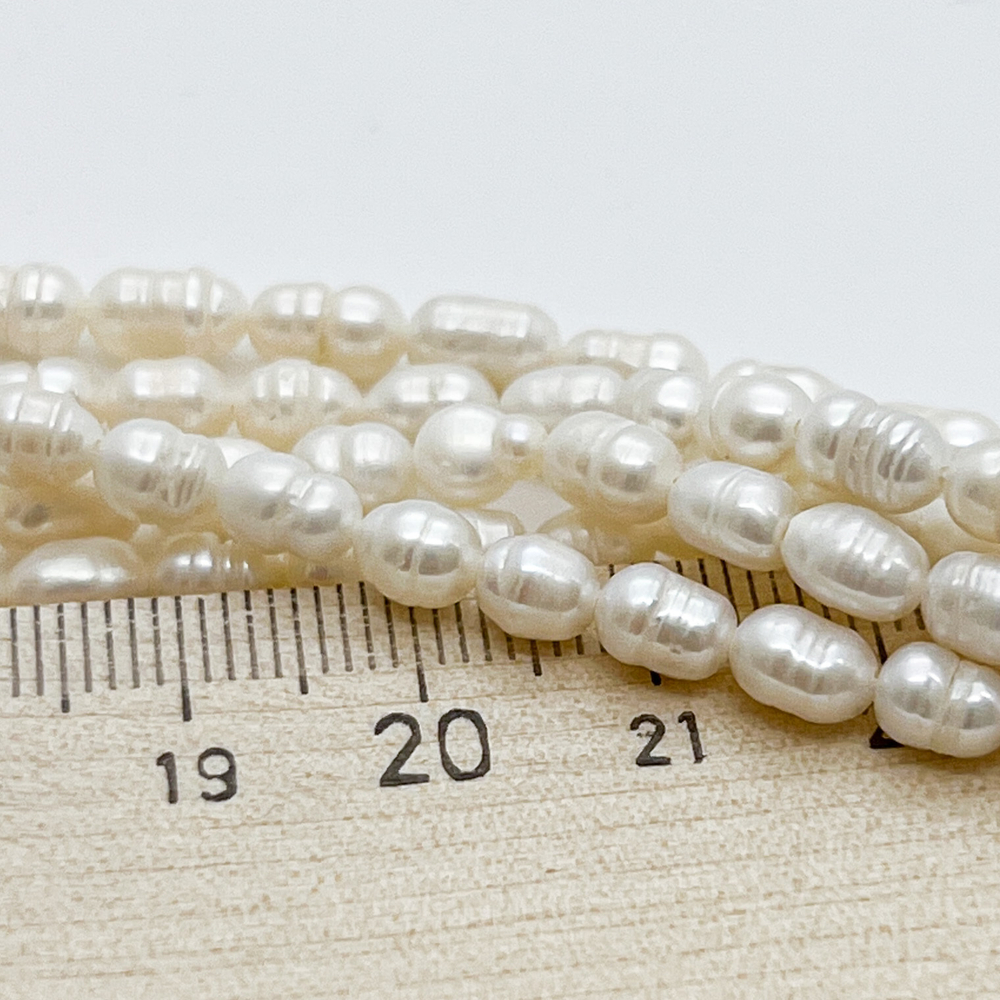 Жемчуг, размер около 6,5*5 мм, цена за 27-28 шт (1/2 нити)