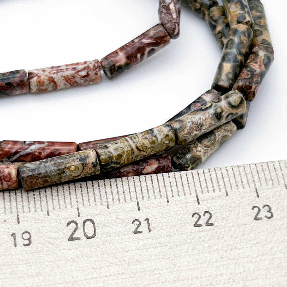 Риолит, размер около 14*4 мм, цена за 13-14 шт (1/2 нити)