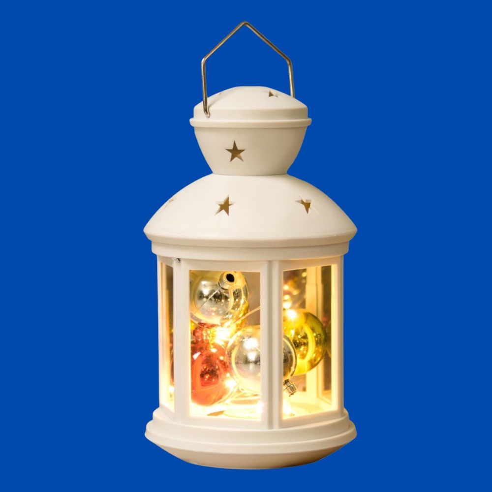 ULD-L1220-012-TTB-WW WHITE Фонарь со светодиодной гирляндой внутри. на батарейке в комплект не входит. 12 светодиодов. Теплый белый свет. Режим мерцания. Белый корпус. 12x20 см. TM Uniel.