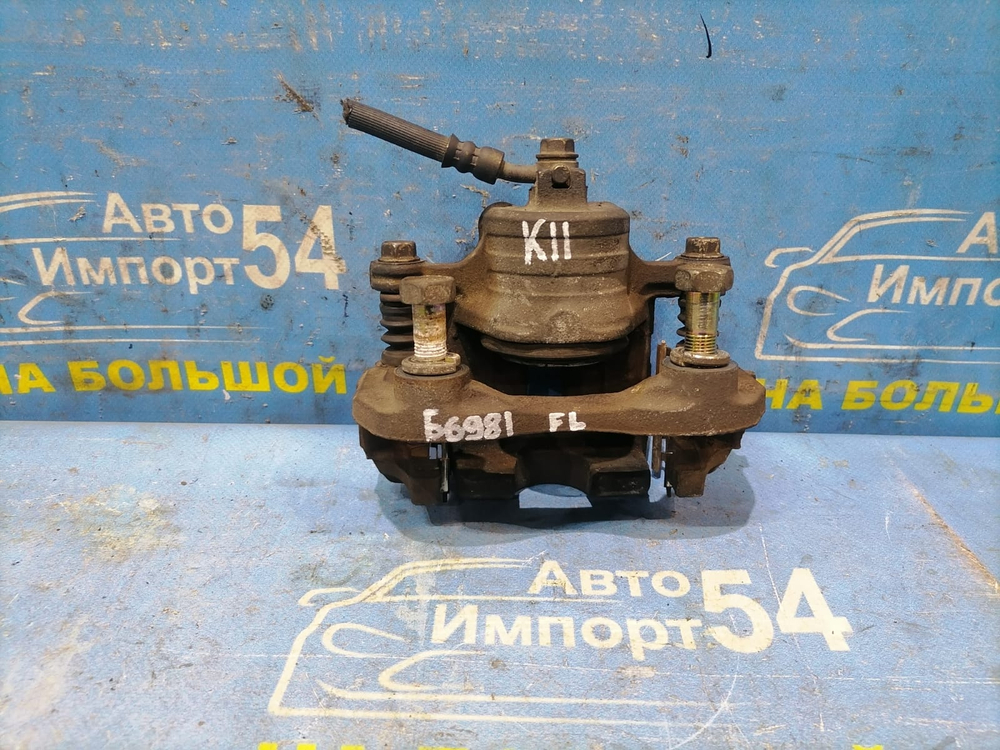 Суппорт тормозной передний левый NISSAN MARCH 1997-2002