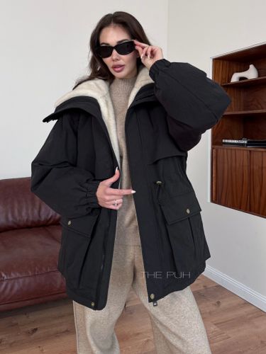 Черная женская куртка трансформер