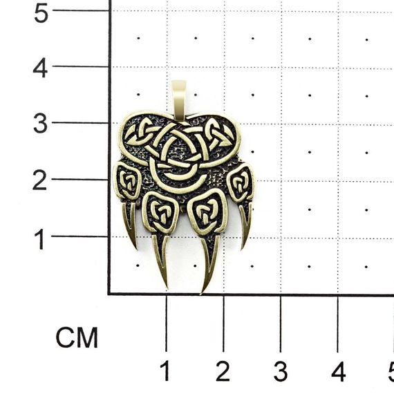 Фотография бронзовой печати Велеса волчья на размерной сетке с фасада.
