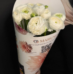 Букет 7 ранункулюсов в цветочной газете.