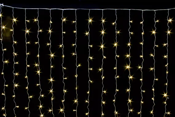 Занавес с контроллером 1.5*1 м., 220V, 100 теплых белых LED ламп, соединяемый, прозрачный провод, Winner (ww.03.5Т.100+)