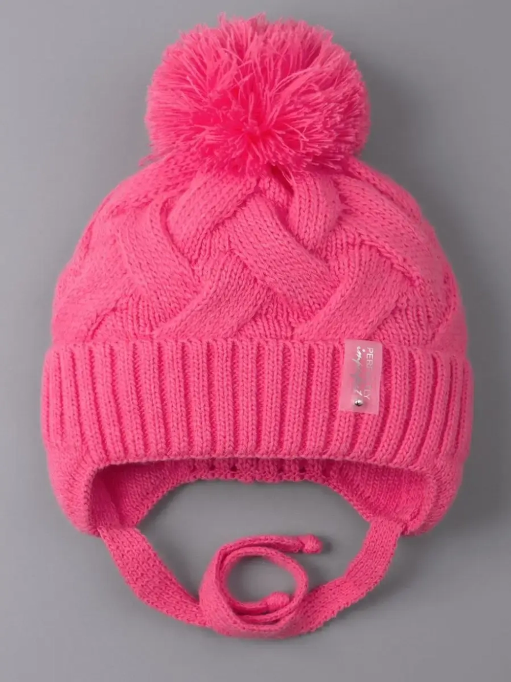 Шапка для девочки на завязках на осень