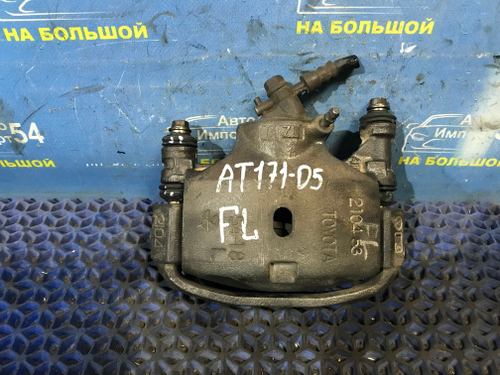 Суппорт тормозной передний левый TOYOTA CARINA 1990