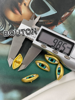 Пуговицы Скиапар. золотистые в форме "Глаза" с голубым (бирюзовым) зрачком