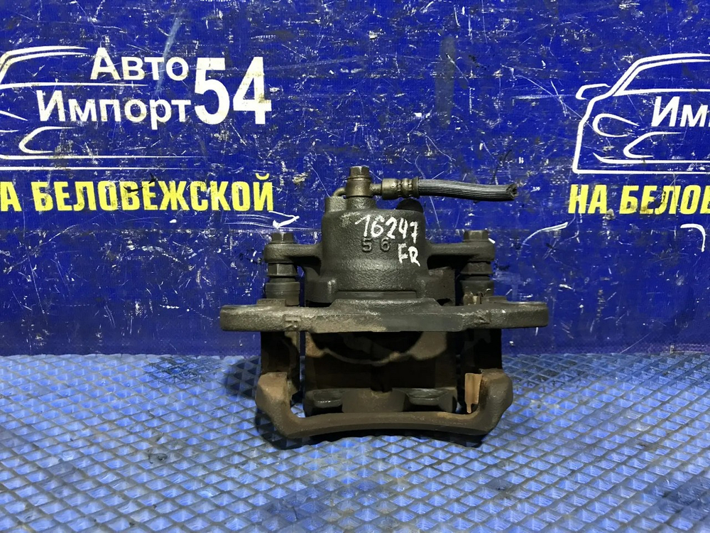 Суппорт тормозной передний правый MAZDA FAMILIA 1998-2003