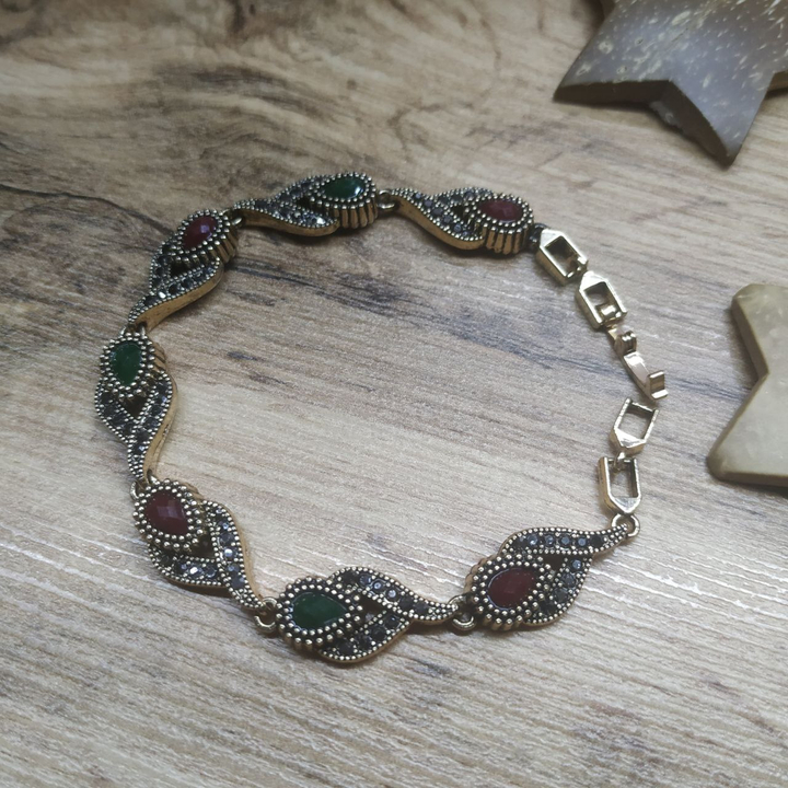 Браслет Vogue Тюльпан кристалл граненый зеленый красный стразы графитовые металл золотистый на красном бархате