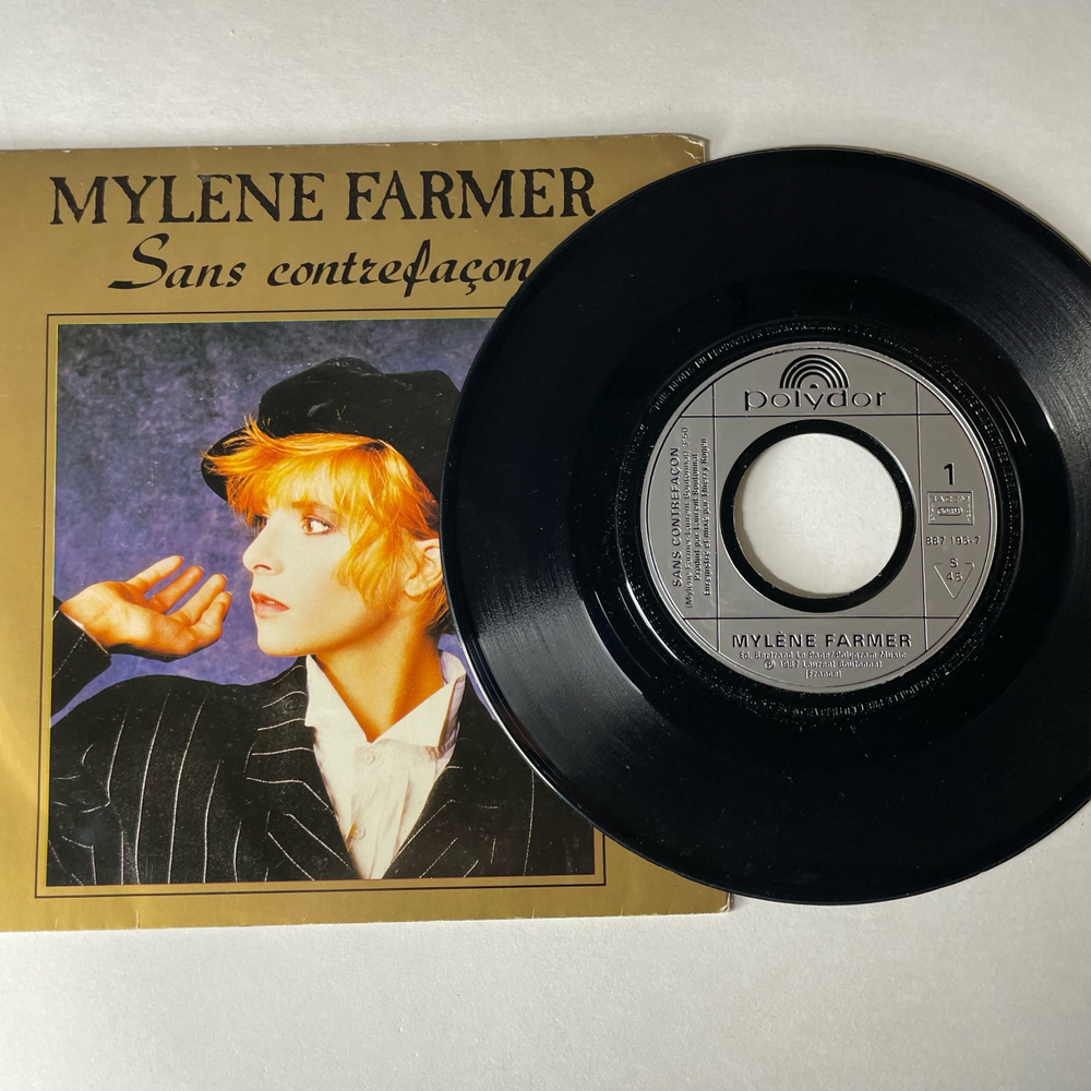 Винтажная виниловая пластинка 7 дюймов (маленькая пластинка) Mylene Farmer Sans Contrefacon (Франция 1987)