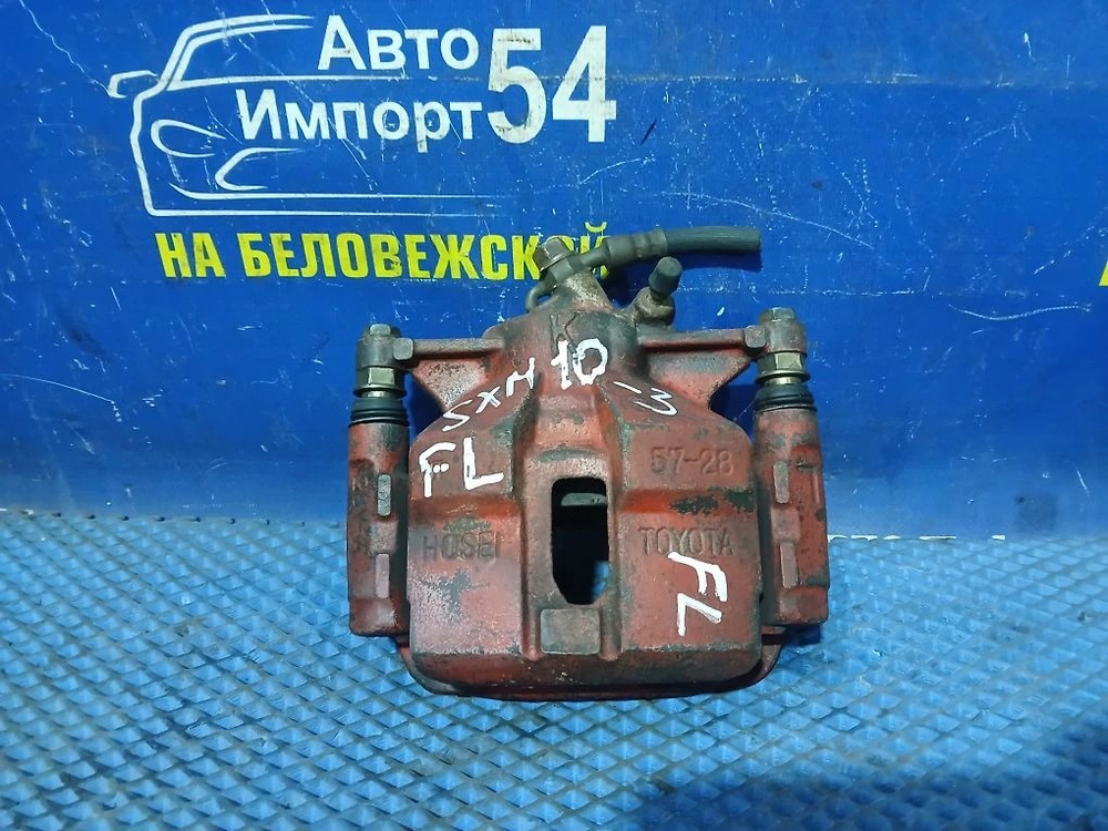 Суппорт тормозной передний левый TOYOTA IPSUM 1999