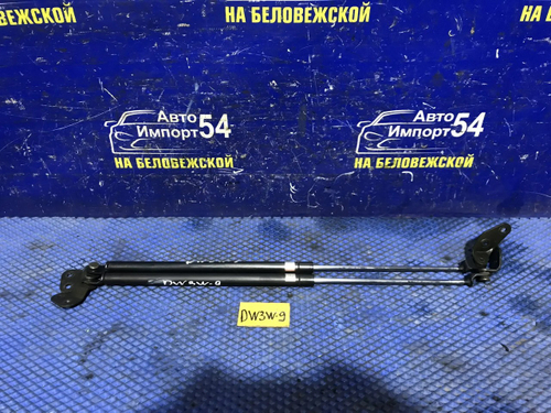 Амортизатор задней двери левый MAZDA DEMIO 2000