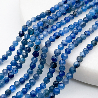 Кианит тонированный граненый бусины, диаметр около 2,8 мм, цена за отрезок 19 см (1/2 нити)