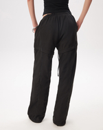 BLACK TRANSFORMING TRACKPANTS