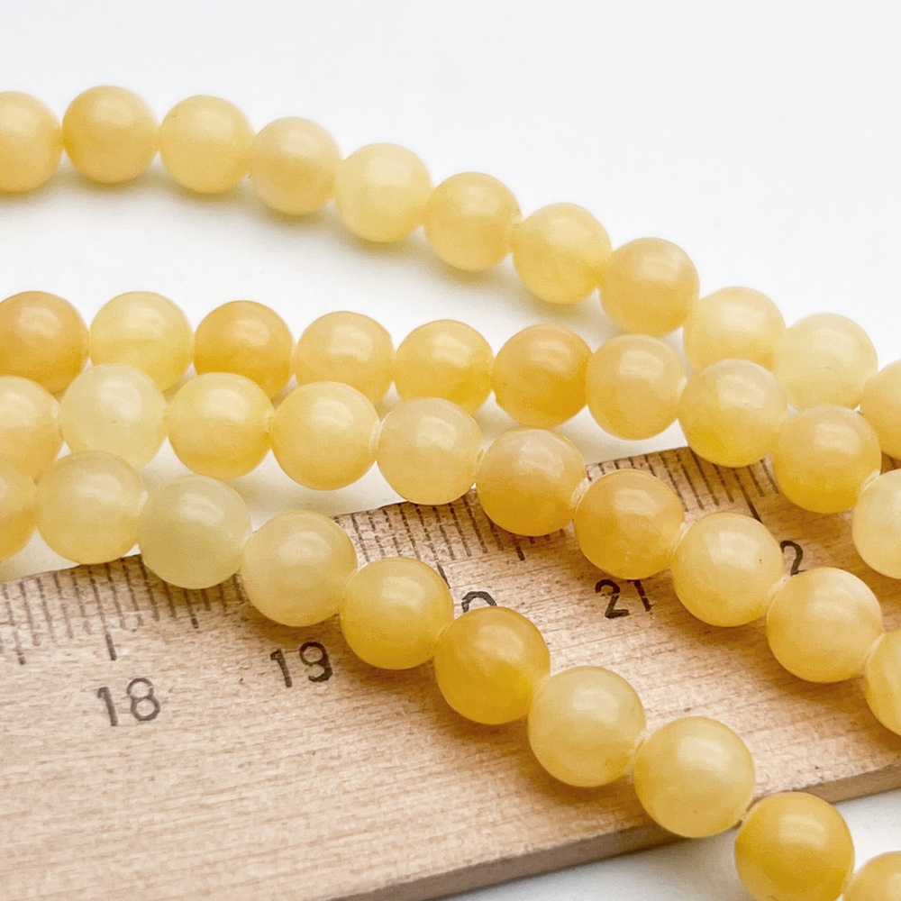 Кальцит желтый бусины, размер около 6,5-6,7 мм, цена за 28-29 шт (1/2 нити)