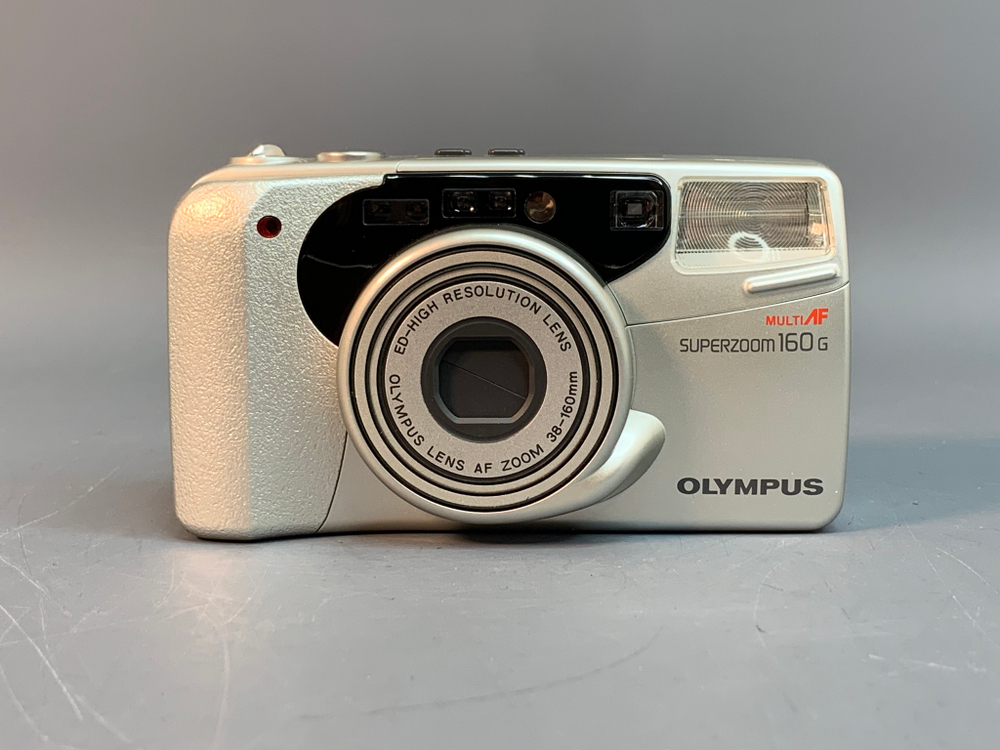 Olympus superzoom 160 G, залипает зум, ошибка