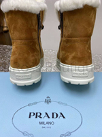 Коричневые высокие кроссовки Prada с мехом