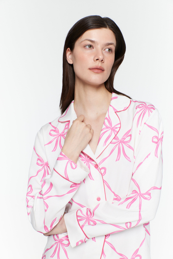 Блуза из вискозы с кантом и бантами
