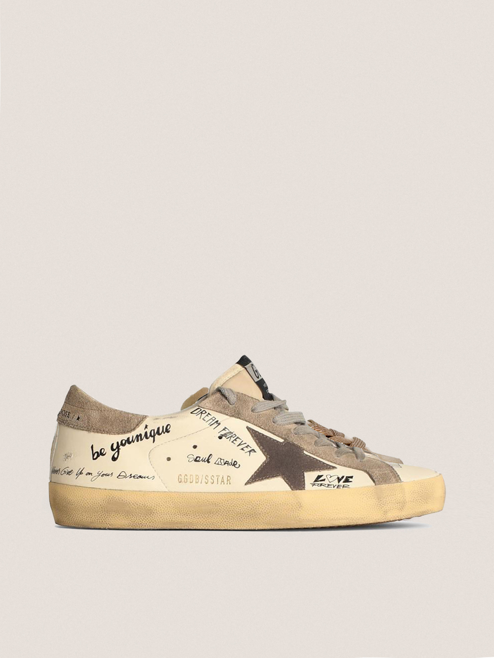 Super Star in white leather with contrasting decorative lettering