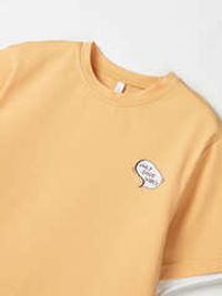 Футболка оверсайз с контрастной отделкой "Абрикос" с принтом