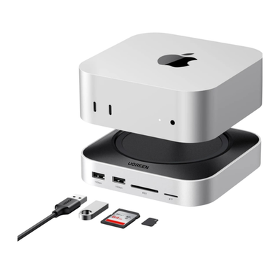 USB-Хаб-подставка с отсеком для SSD Ugreen для Mac mini (M4 | 2024) (CM841) Подключение: встроенный плоский L-образный кабель USB-C (4 см), USB-C (15 Вт). Порты: 2 USB-C 3.2 Gen 2, 3 USB-A 3.2 Gen 2, 2 USB-A 3.2 Gen 1, microSD, SD. Есть отсек для SSD M.2