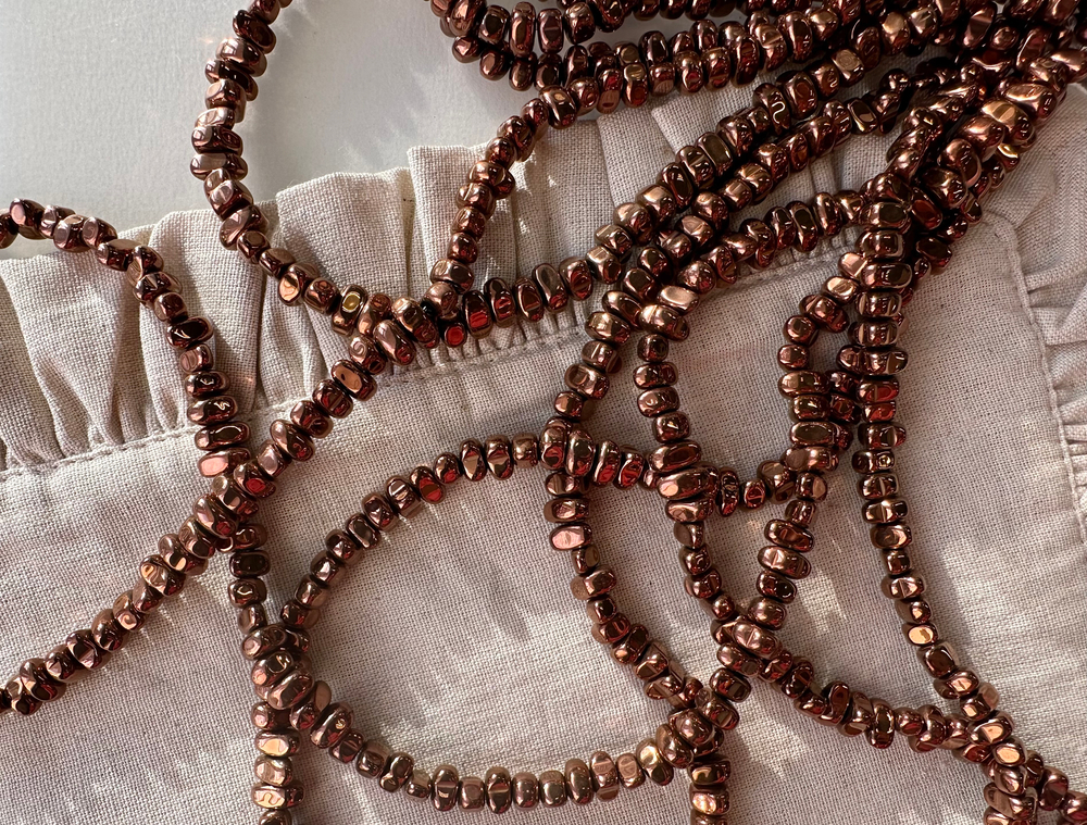 Нить гематитовых бусин, 7-9мм, галтовка