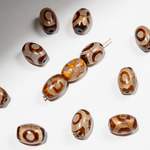 Бусина Дзи "Три глаза" из агата, 10*14мм, коричневый