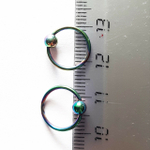 Кольцо сегментное 1,2мм (бензинка), диаметр 10мм, шарик 4мм для пирсинга. Медицинская сталь, покрытие титан.