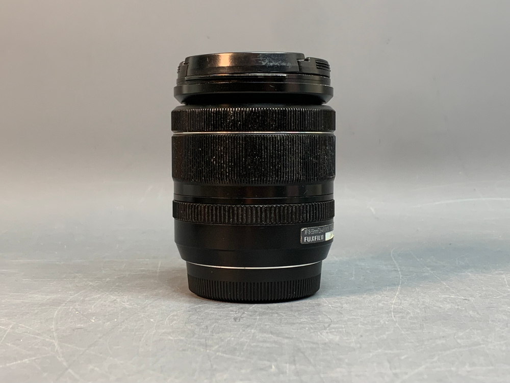 FujiFilm XF 18-55mm 2.8-4 R LM OIS, маленький точка на передней линзе