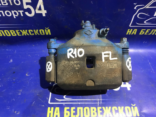 Суппорт тормозной передний левый NISSAN PRESEA 1993