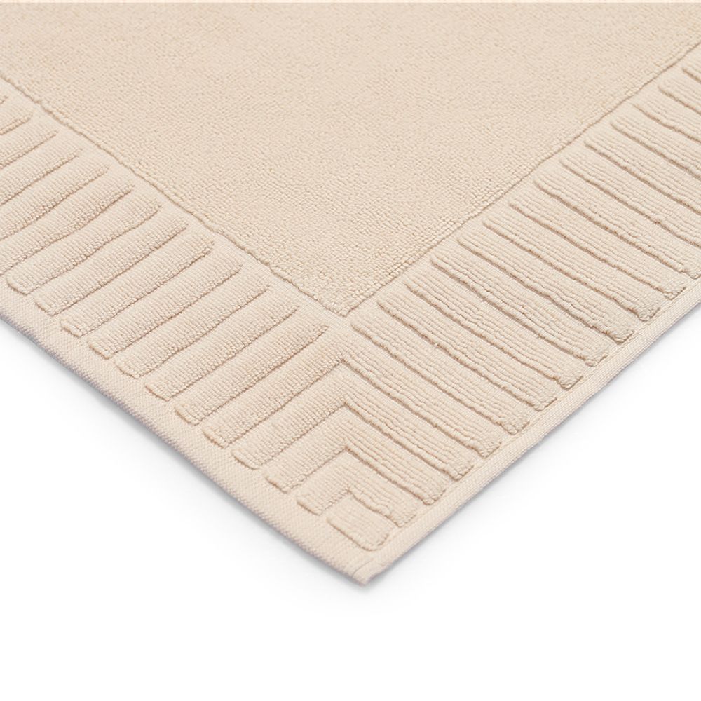 Коврик для ванной с фактурным бортиком кремового цвета из коллекции Essential, 50x80 см