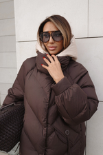 Пуховик средней длины с декором на карманах