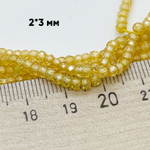 Фианит, рондель с огранкой, цвет желтый, размер около 3,1*2,3 мм, цена за нить 38 см (около 165 шт)