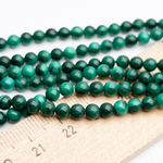 Малахит бусины, диаметр 4,1-4,2 мм, цена за отрезок 19 см (1/2 нити)