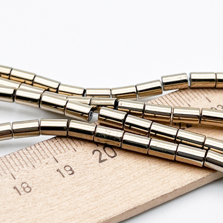 Гематит Трубочка бусины (имитация), цвет золотистый, размер около 6*3,8 мм, цена за отрезок 19 см (1/2 нити)