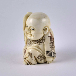 Нэцкэ Ребенок карако с письменными принадлежностями