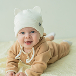 Шапка трикотажная на завязках "Молочный" 0+