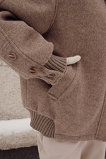 Пуховик средней длины из шерсти с капюшоном