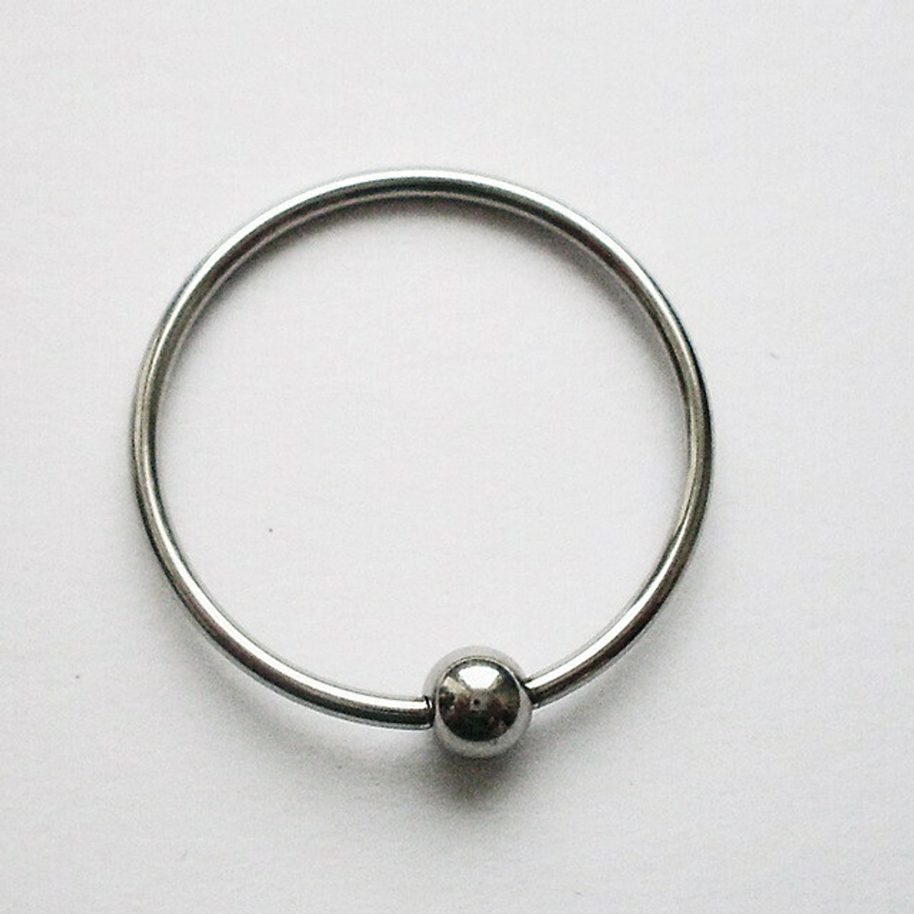 Кольцо сегментное для пирсинга: диаметр 20 мм, толщина 1,2 мм, шарик 4 мм. Медицинская сталь