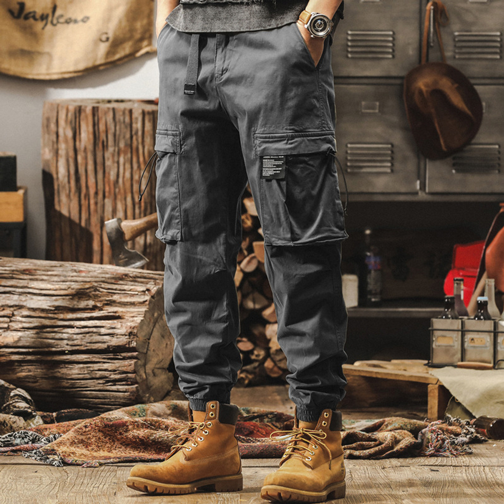 Брюки для мужчин свободные с накладными карманами и резинками внизу брючины от бренда JIELEINUO