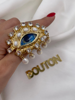 Брошь Скиапар. золотистое в форме голубого глаза с жемчугами и стразами