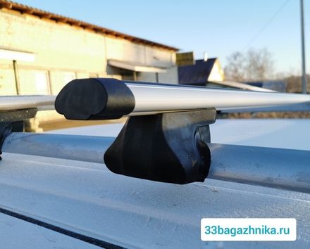 Багажник Интер Фаворит на рейлинги  с аэро дугой 120 см.