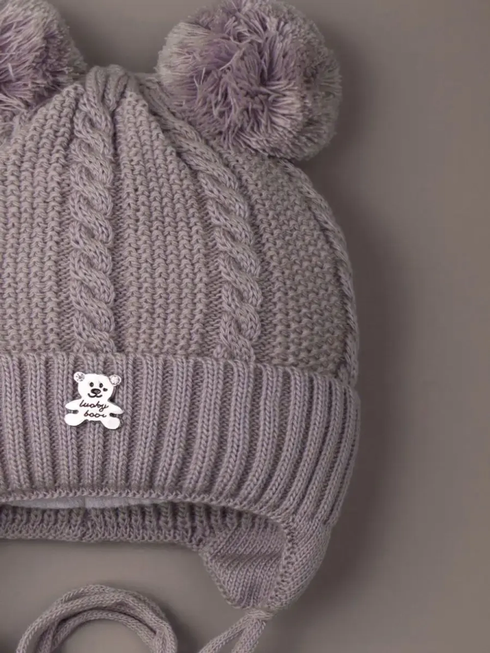 Шапка вязаная демисезонная на завязках