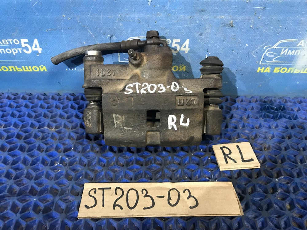 Суппорт тормозной задний левый TOYOTA CORONA EXIV 1996